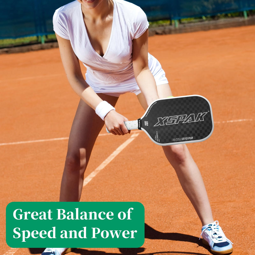 XS XSPAK paddle in play showing reliable shot placement during volley rallies