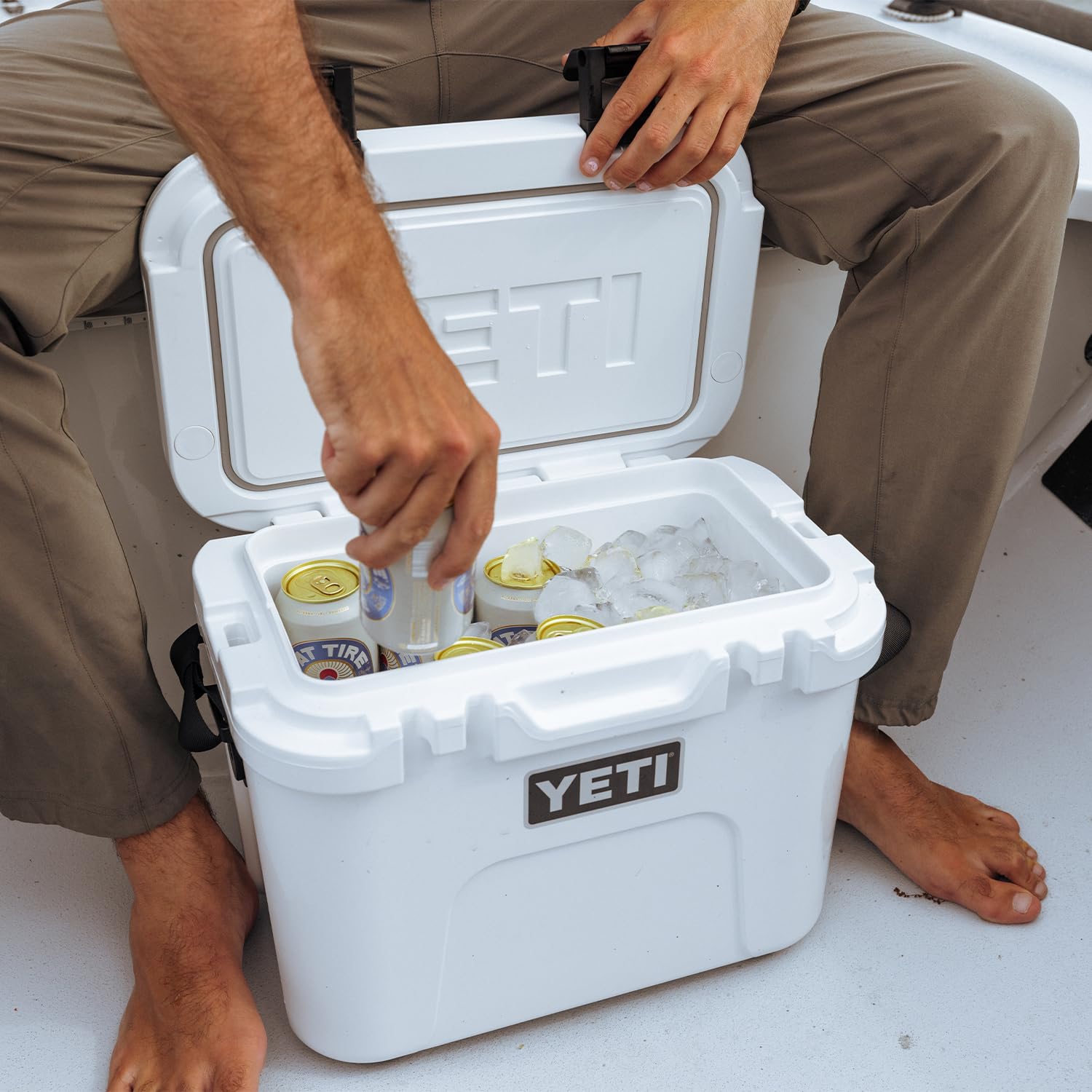 YETI Roadie 15 next to backpack illustrating scale and portability