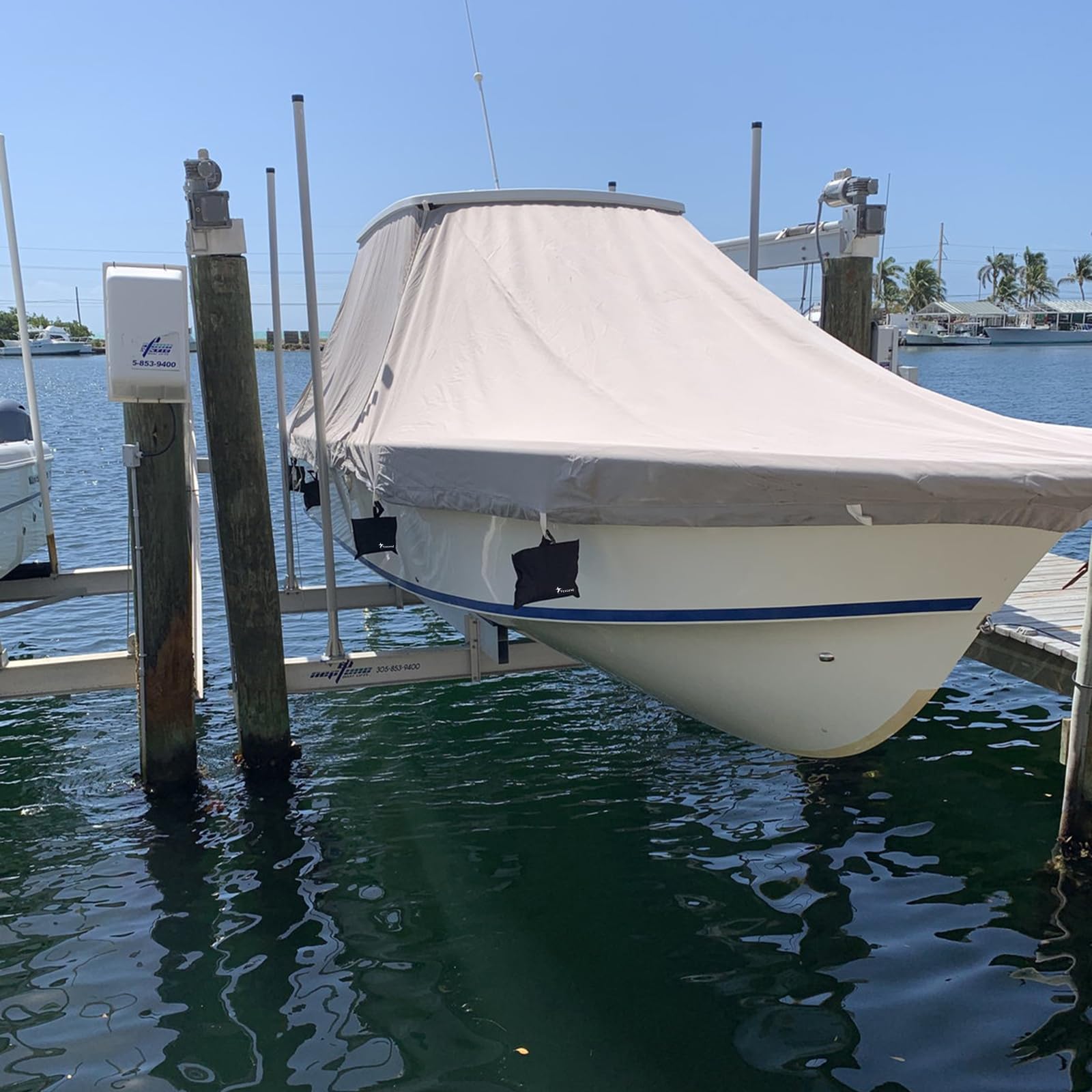 Yexcend dockside lifestyle scene with covered boat kept secure