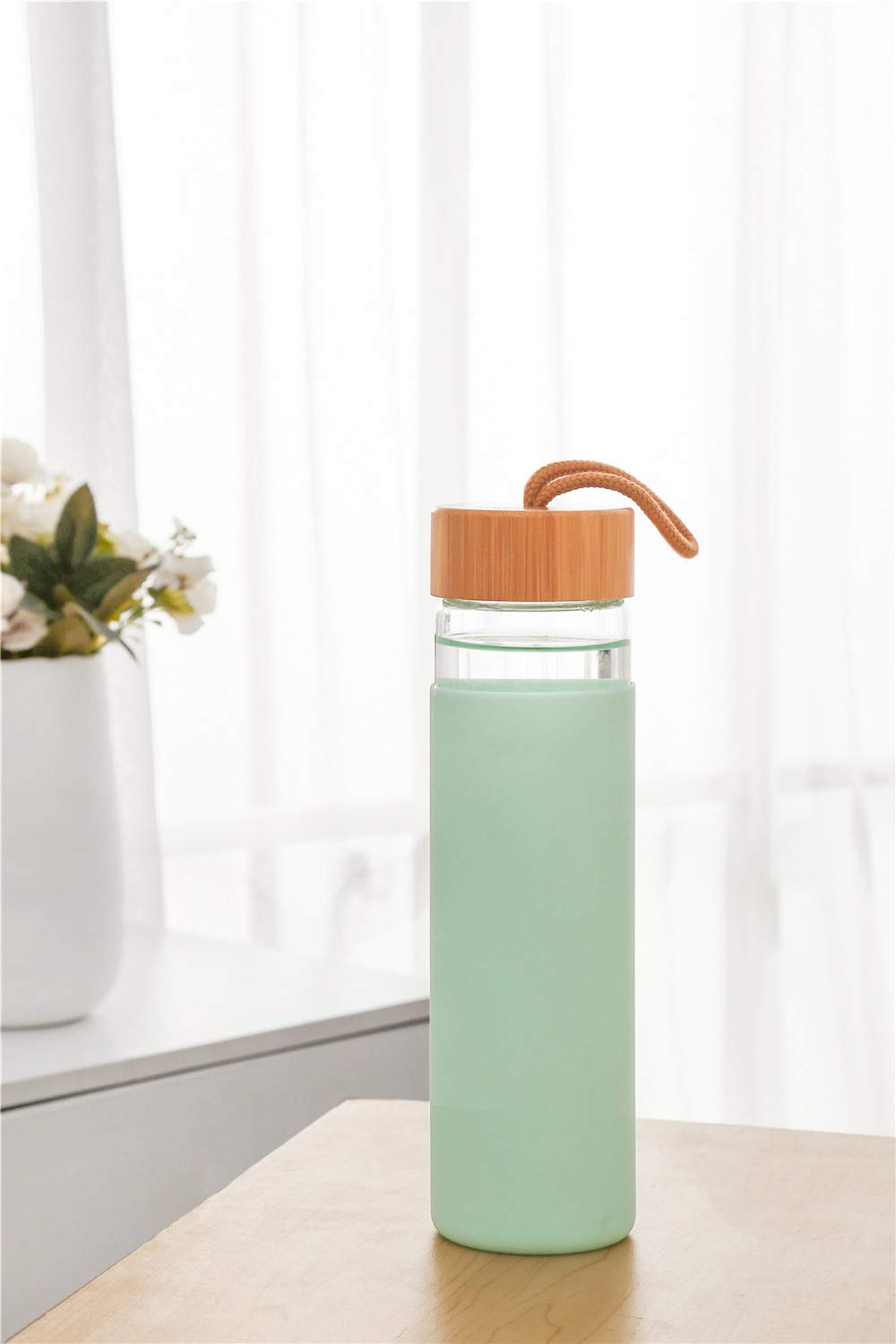 Yomious glass bottle loaded into dishwasher showing dishwasher-safe cleaning benefit