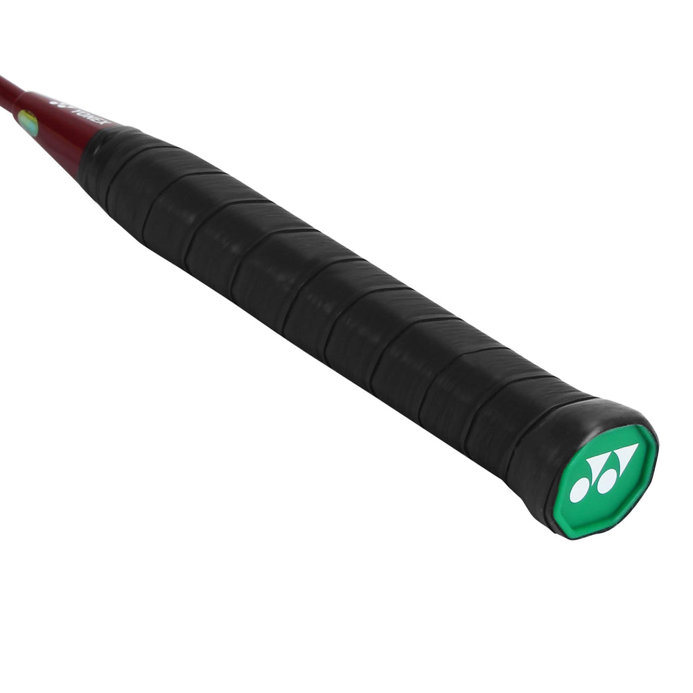 Yonex GR 303i next to shuttle for scale showing compact, easy-to-handle size