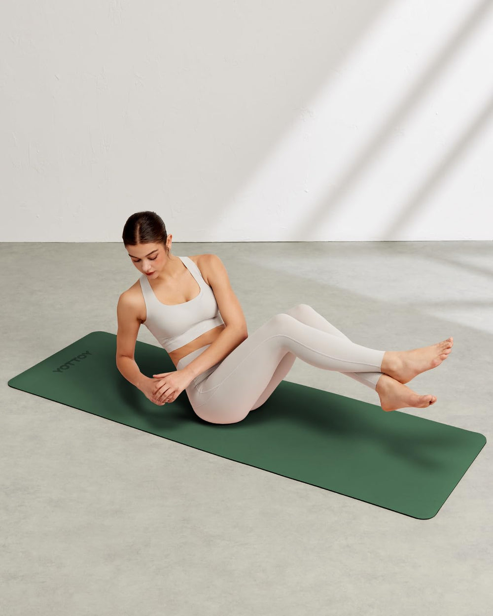YOTTOY mat on grass for outdoor yoga emphasizing lightweight transportability