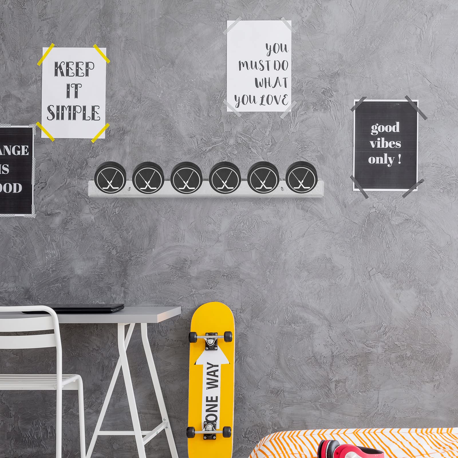 Yulejo in a game-room setting showcasing pucks as stylish sports memorabilia