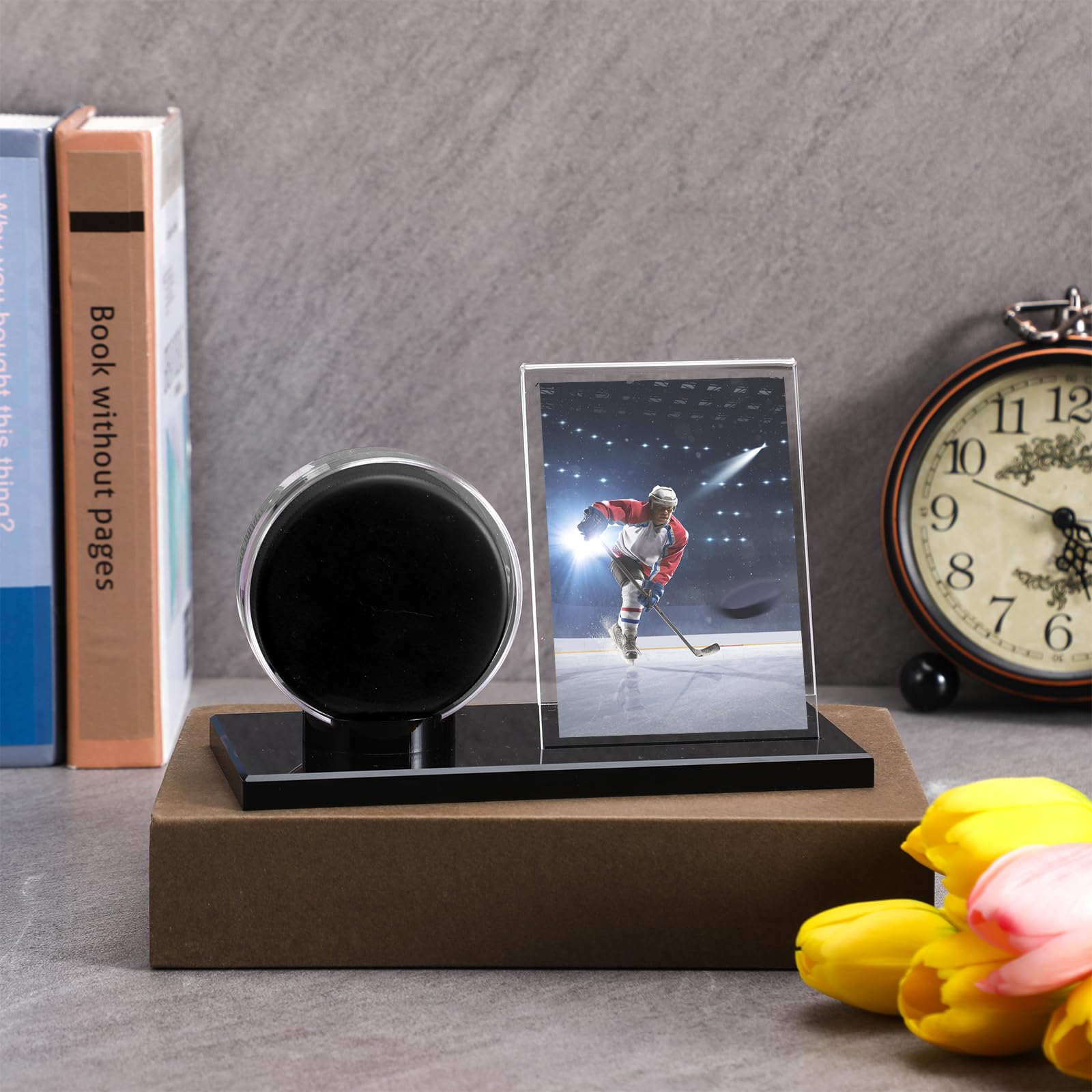 Yuntau card inserted beside puck displaying organized memorabilia
