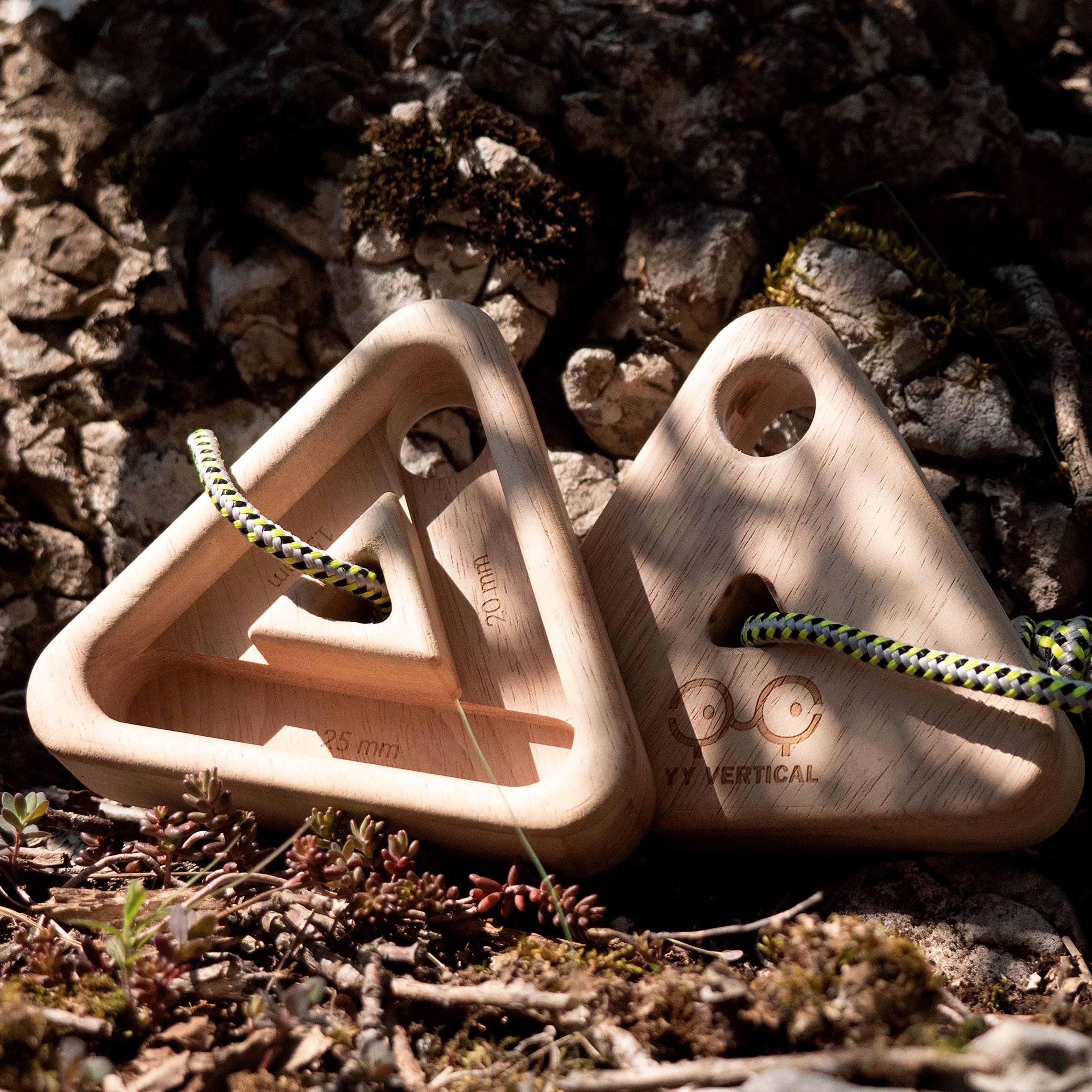 YY Vertical triangle held next to hand showing compact scale and portability benefit