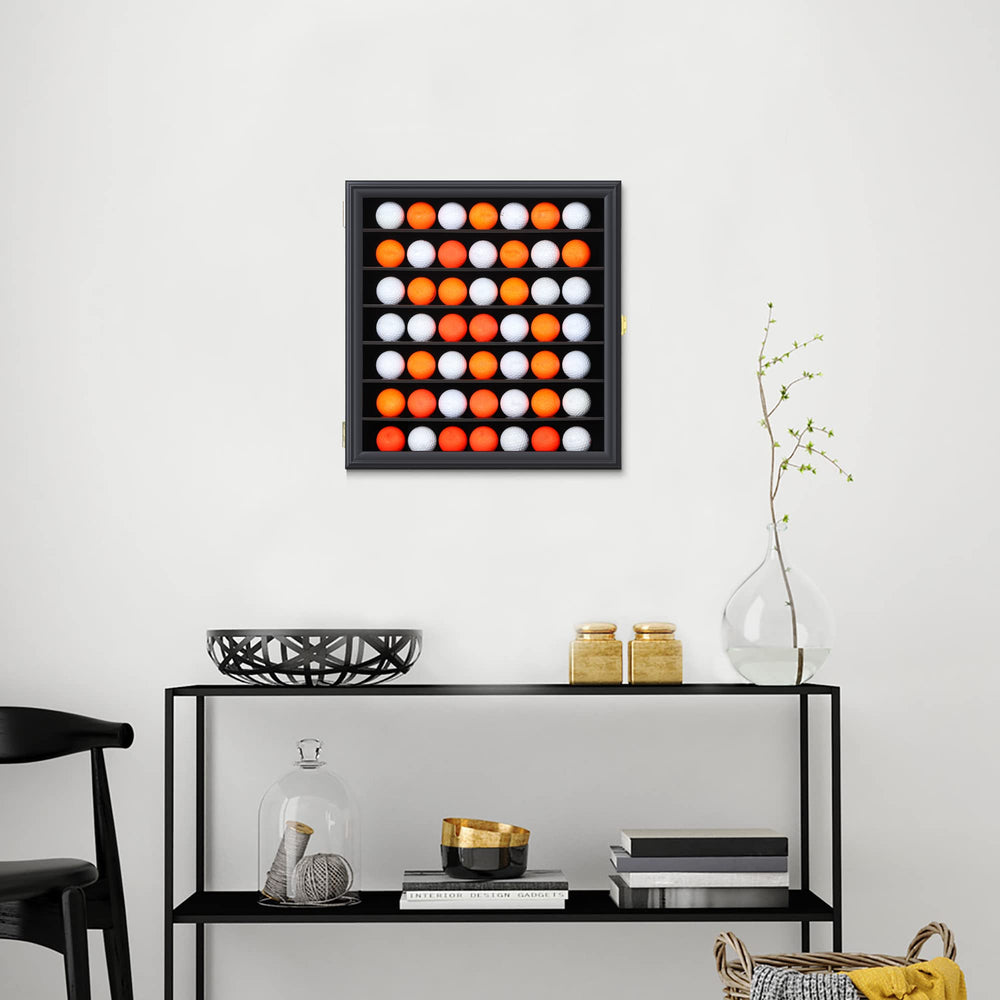 Zmiky display next to golf balls showing compact scale and space-saving benefits